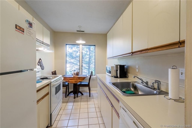 500 Prospect St Apt 1F, New Haven, CT 06511 - kitchen with white appliances, a sink, under cabinet range hood, light tile patterned floors, and light countertops