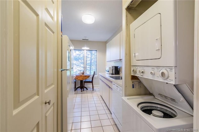 500 Prospect St Apt 1F, New Haven, CT 06511 - laundry area featuring stacked washing machine and dryer and light tile patterned floors
