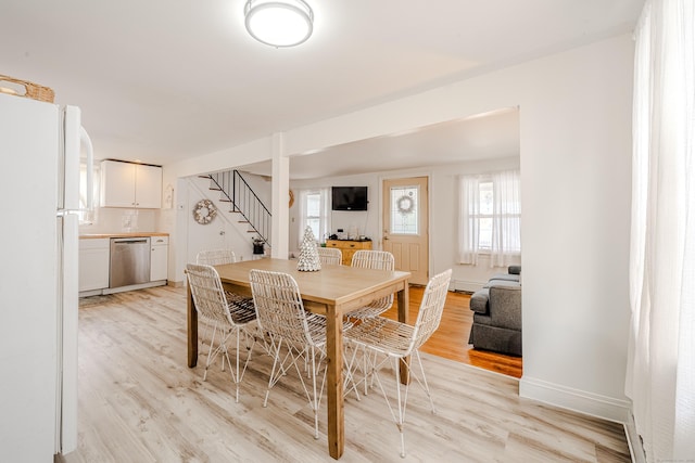10 Sperry St, Milford, CT 06460 - dining space with stairs, light wood-style flooring, healthy amount of natural light, and baseboards