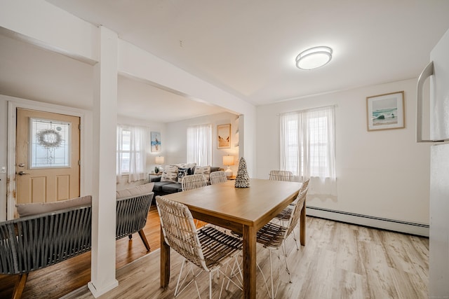 10 Sperry St, Milford, CT 06460 - dining room featuring a baseboard radiator, plenty of natural light, and light wood-style floors