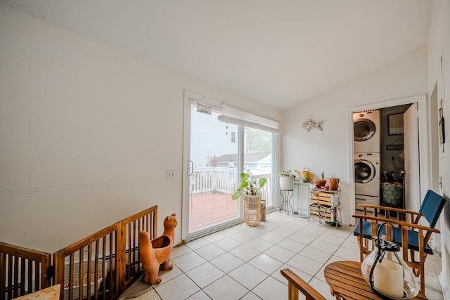 10 Sperry St, Milford, CT 06460 - sitting room featuring stacked washer / drying machine and light tile patterned floors