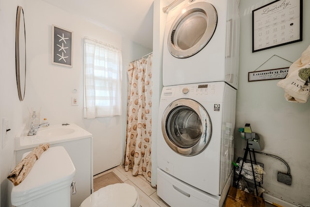 10 Sperry St, Milford, CT 06460 - laundry room with stacked washer / dryer and light tile patterned floors