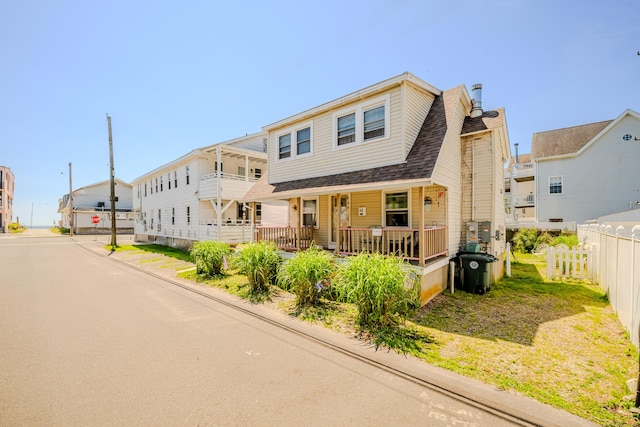 10 Sperry St, Milford, CT 06460 - view of property featuring a porch and a shingled roof