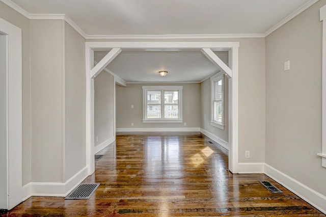 interior space with visible vents, wood finished floors, and baseboards