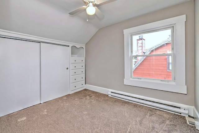 bonus room featuring carpet, a ceiling fan, baseboards, baseboard heating, and vaulted ceiling