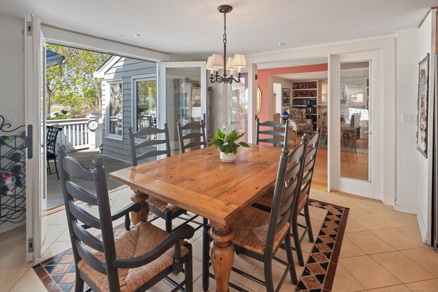 43 Pine Point Rd, Norwalk, CT 06853 - dining space featuring light tile patterned floors and a chandelier