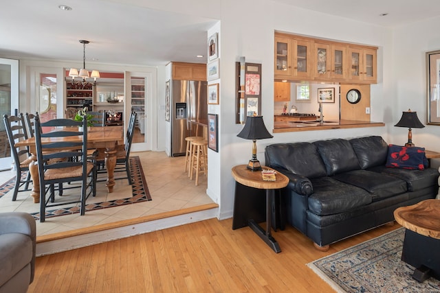 43 Pine Point Rd, Norwalk, CT 06853 - living room with a notable chandelier and light wood finished floors
