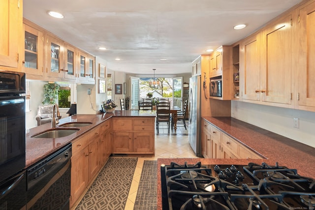 43 Pine Point Rd, Norwalk, CT 06853 - kitchen with recessed lighting, light tile patterned floors, a sink, a peninsula, and black appliances