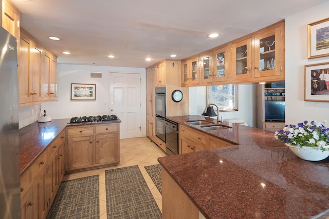 43 Pine Point Rd, Norwalk, CT 06853 - kitchen with a sink, a peninsula, light tile patterned flooring, black appliances, and glass insert cabinets