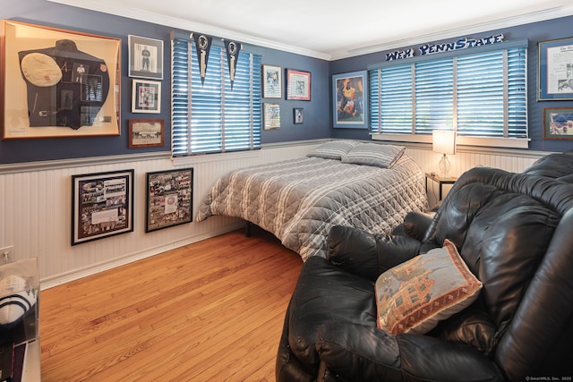 43 Pine Point Rd, Norwalk, CT 06853 - bedroom with ornamental molding, a wainscoted wall, and wood finished floors