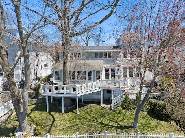 43 Pine Point Rd, Norwalk, CT 06853 - back of property featuring a deck, a yard, fence private yard, a chimney, and a shingled roof