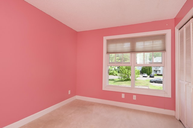 75 Redwood Dr Unit 609, East Haven, CT 06513 - spare room with light carpet and baseboards