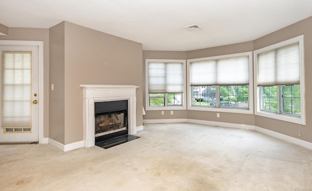 75 Redwood Dr Unit 609, East Haven, CT 06513 - unfurnished living room with carpet, a fireplace with flush hearth, and baseboards