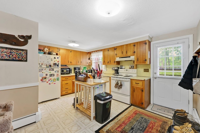 kitchen with a baseboard radiator, under cabinet range hood, white appliances, brown cabinets, and light countertops