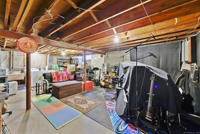 unfinished basement featuring independent washer and dryer