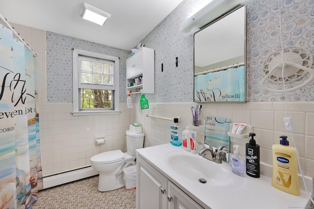 full bathroom with tile walls, a wainscoted wall, baseboard heating, and wallpapered walls