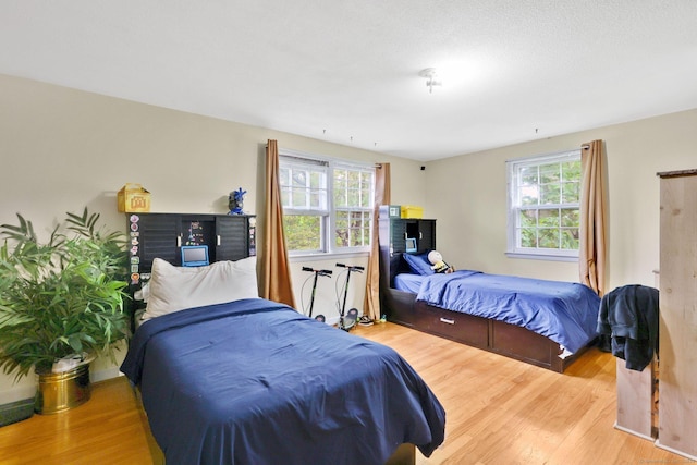 bedroom featuring wood finished floors