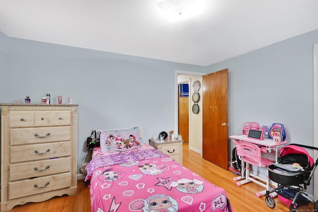 bedroom with light wood-style flooring