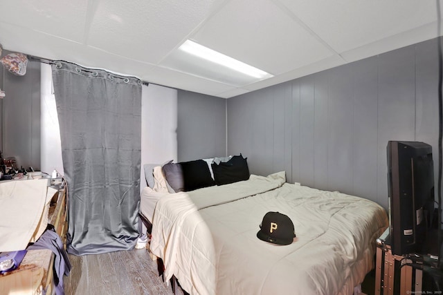 bedroom with wood finished floors