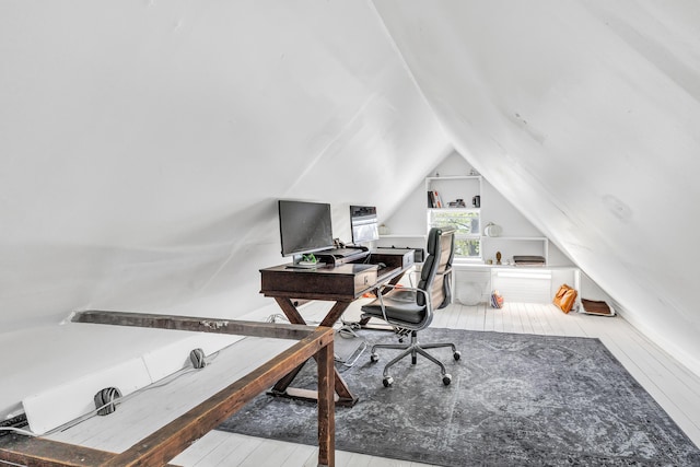 office space featuring wood-type flooring and lofted ceiling