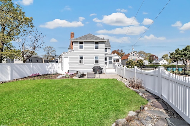 rear view of house featuring an outdoor hangout area, a chimney, a patio, entry steps, and a shingled roof