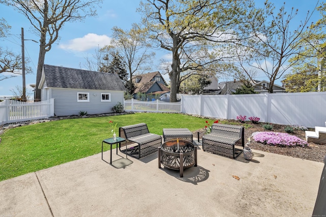 view of patio / terrace featuring an outdoor fire pit and an outbuilding
