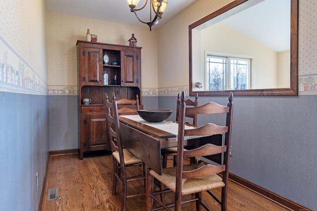 23 Hefflon Farm Rd, Old Lyme, CT 06371 - dining room featuring wallpapered walls, wood finished floors, and a chandelier