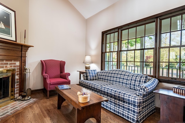 23 Hefflon Farm Rd, Old Lyme, CT 06371 - living area with lofted ceiling, healthy amount of natural light, wood finished floors, and a fireplace
