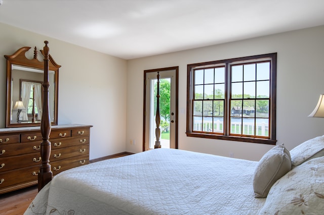 23 Hefflon Farm Rd, Old Lyme, CT 06371 - bedroom with wood finished floors, access to exterior, and baseboards