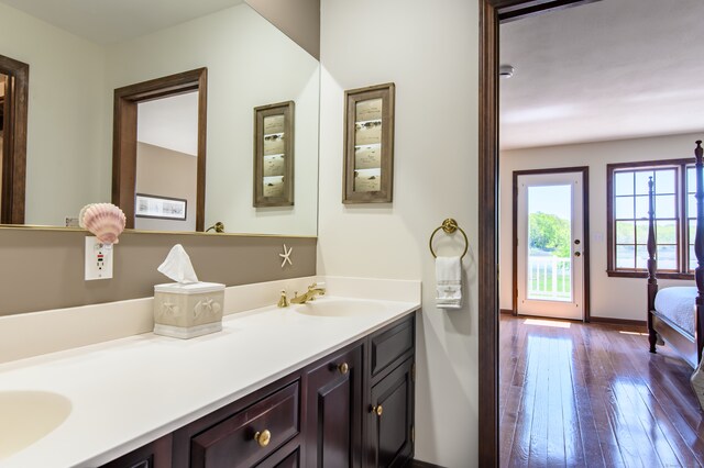 23 Hefflon Farm Rd, Old Lyme, CT 06371 - bathroom featuring double vanity, hardwood / wood-style flooring, and baseboards