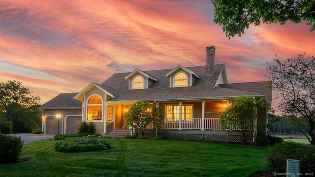 23 Hefflon Farm Rd, Old Lyme, CT 06371 - view of front facade with a garage, a lawn, a porch, a chimney, and driveway