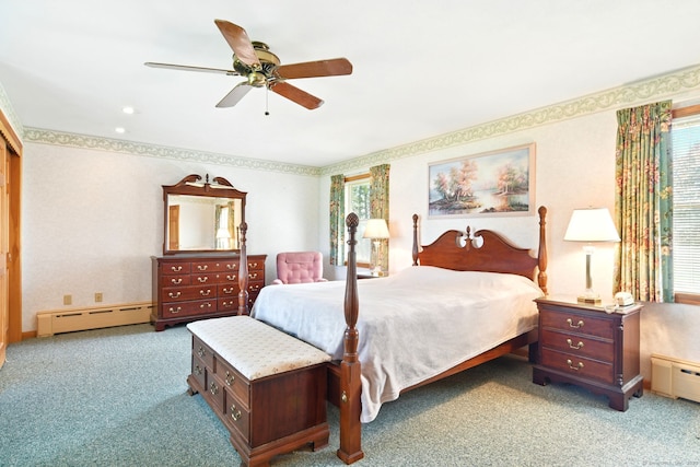 bedroom with baseboard heating, carpet, and a ceiling fan