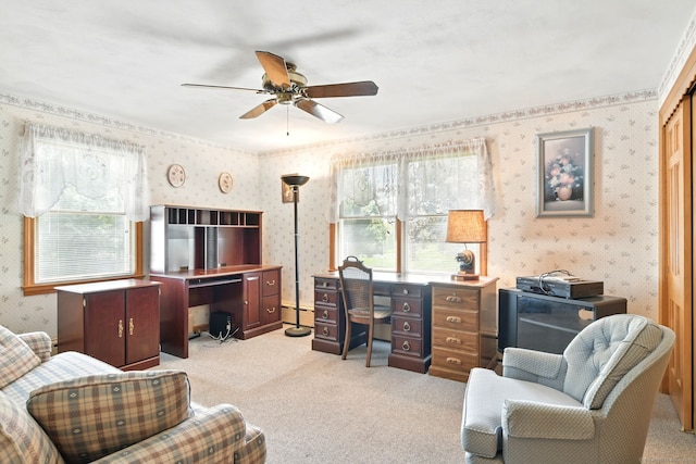 office featuring wallpapered walls, light carpet, ceiling fan, and a baseboard heating unit