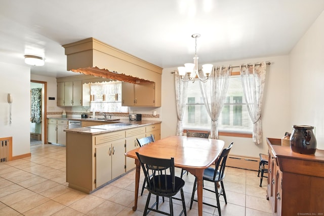 kitchen featuring a chandelier, light tile patterned floors, a baseboard radiator, and a peninsula