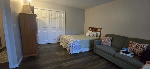 bedroom with a closet and dark wood-type flooring