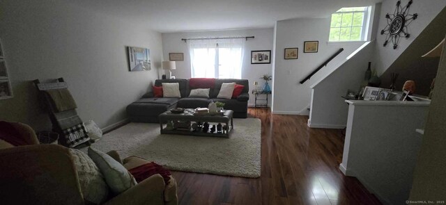 living room featuring baseboards and wood finished floors