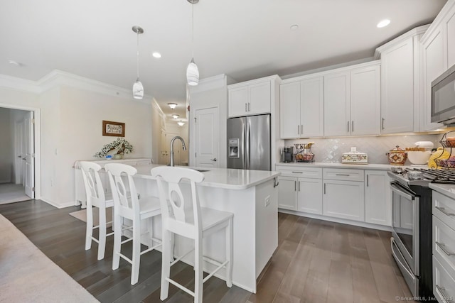 1022 Country View Rd Unit 1022, Danbury, CT 06810 - kitchen featuring appliances with stainless steel finishes, recessed lighting, light countertops, crown molding, and dark wood-style flooring