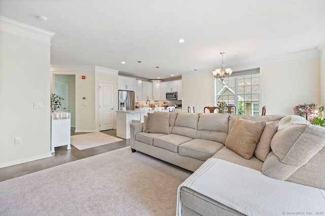 1022 Country View Rd Unit 1022, Danbury, CT 06810 - living area featuring crown molding, a chandelier, wood finished floors, and recessed lighting