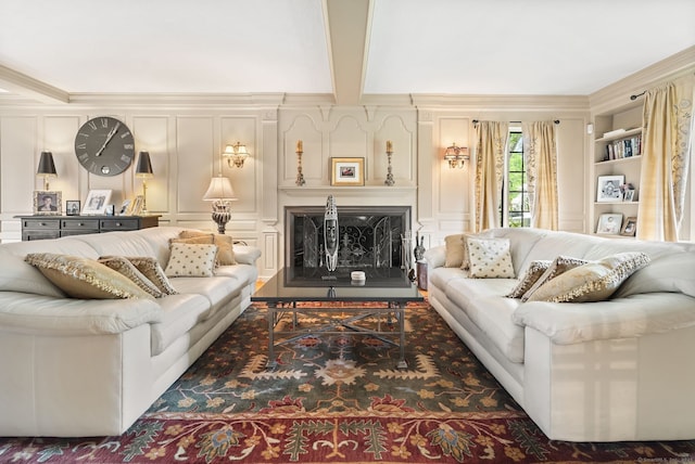 44 Walbridge Rd, West Hartford, CT 06119 - living room with a decorative wall, a fireplace, and crown molding