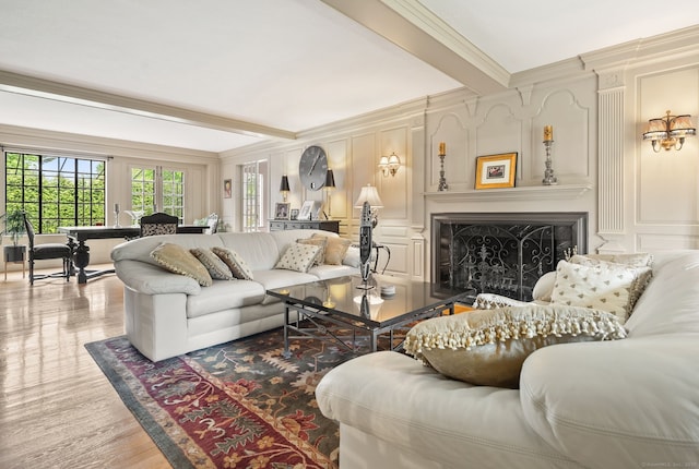 44 Walbridge Rd, West Hartford, CT 06119 - living room with crown molding, a decorative wall, a fireplace, wood finished floors, and beam ceiling
