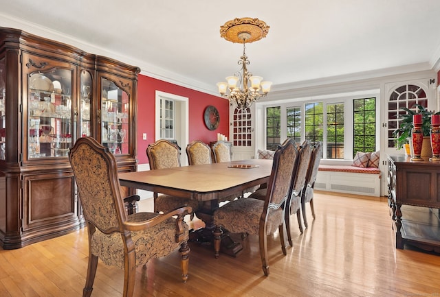 44 Walbridge Rd, West Hartford, CT 06119 - dining area featuring a chandelier, light wood-style floors, and ornamental molding
