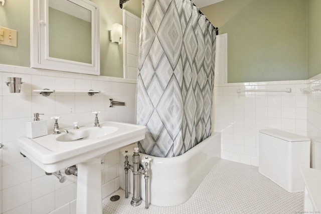 44 Walbridge Rd, West Hartford, CT 06119 - bathroom with tile walls, shower / tub combo, tile patterned floors, and wainscoting