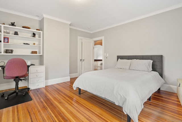 44 Walbridge Rd, West Hartford, CT 06119 - bedroom with crown molding, light wood finished floors, and baseboards