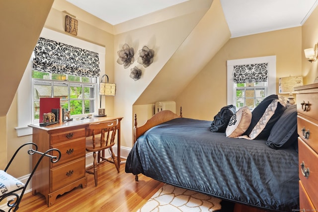 44 Walbridge Rd, West Hartford, CT 06119 - bedroom with radiator, wood finished floors, baseboards, vaulted ceiling, and crown molding