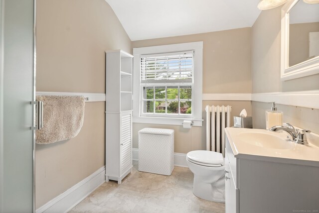 44 Walbridge Rd, West Hartford, CT 06119 - bathroom with vaulted ceiling, toilet, radiator, baseboards, and vanity