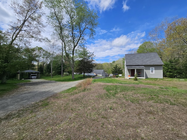 69 Elmdale Rd, Canterbury, CT 06331 - view of yard featuring dirt driveway and a detached carport