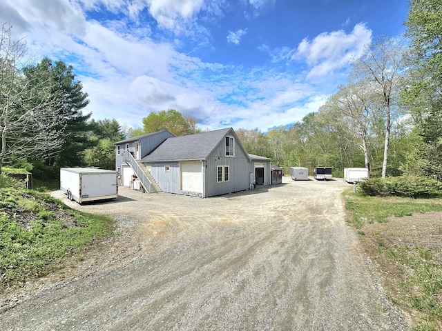 69 Elmdale Rd, Canterbury, CT 06331 - view of home's exterior with driveway, a storage unit, and an outbuilding