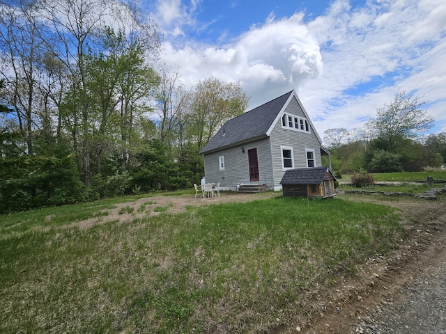 69 Elmdale Rd, Canterbury, CT 06331 - view of property exterior with a shingled roof, entry steps, and an outdoor structure