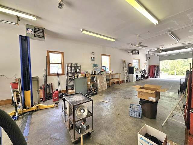 69 Elmdale Rd, Canterbury, CT 06331 - garage featuring ceiling fan and a workshop area