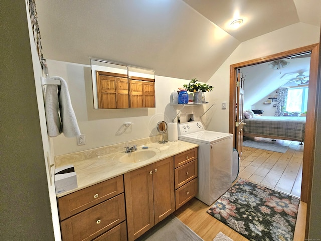 69 Elmdale Rd, Canterbury, CT 06331 - clothes washing area featuring washer / dryer, a sink, and light wood-style flooring